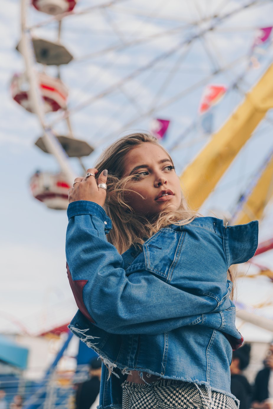 woman-in-denim-jacket-at-fair